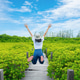 Young woman jumping on wooden boardwalk in lush mangrove forest during summer. Freedom happiness and Young woman jumping on wooden boardwalk in lush mangrove forest during summer. Freedom happiness and - PhotoDune Item for Sale