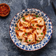 Wontons are placed in a bowl with spicy sauce. Wontons are placed in a bowl with spicy sauce. - PhotoDune Item for Sale