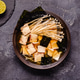 Asian-style soup with squid, tofu and enoki mushrooms. Asian-style soup with squid, tofu and enoki mushrooms. - PhotoDune Item for Sale