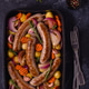 Fried sausages with vegetables. Fried sausages with vegetables. - PhotoDune Item for Sale