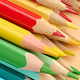 Multicolored wooden pencils stacked on a beige background Multicolored wooden pencils stacked on a beige background - PhotoDune Item for Sale