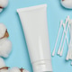 White plastic tube for cosmetics or cream on blue background, top view, minimalist mockup for brand White plastic tube for cosmetics or cream on blue background, top view, minimalist mockup for brand - PhotoDune Item for Sale