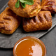 Freshly baked puff pastries on a black board against a dark background, top view Freshly baked puff pastries on a black board against a dark background, top view - PhotoDune Item for Sale