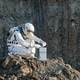 Astronaut conducts research on the lunar surface during a mission in space exploration Astronaut conducts research on the lunar surface during a mission in space exploration - PhotoDune Item for Sale