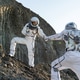 Two astronauts explore the lunar surface and assist each other during their mission Two astronauts explore the lunar surface and assist each other during their mission - PhotoDune Item for Sale