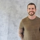 Portrait of bearded caucasian man with tattoos standing against a textured gray Portrait of bearded caucasian man with tattoos standing against a textured gray - PhotoDune Item for Sale