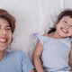 Portrait of asian mom and little daughter are cuddling and smiling in white bed room Portrait of asian mom and little daughter are cuddling and smiling in white bed room - PhotoDune Item for Sale