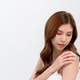 Woman Applying Skincare Cream on Her Shoulder Woman Applying Skincare Cream on Her Shoulder - PhotoDune Item for Sale