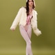 Stylish young fashion model in faux fur on olive green backdrop Stylish young fashion model in faux fur on olive green backdrop - PhotoDune Item for Sale
