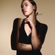 Young woman exudes modern elegance in stylish attire against a soft backdrop Young woman exudes modern elegance in stylish attire against a soft backdrop - PhotoDune Item for Sale