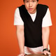 Stylish young man showcases modern fashion in vibrant orange studio setting Stylish young man showcases modern fashion in vibrant orange studio setting - PhotoDune Item for Sale