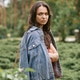 Young woman enjoying the serenity of a park while dressed in cozy, stylish attire Young woman enjoying the serenity of a park while dressed in cozy, stylish attire - PhotoDune Item for Sale