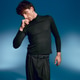 Stylish young man exudes elegance with confident pose against vibrant background Stylish young man exudes elegance with confident pose against vibrant background - PhotoDune Item for Sale