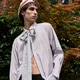 Young man in retro outfit poses outdoors against vibrant nature Young man in retro outfit poses outdoors against vibrant nature - PhotoDune Item for Sale