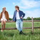 Young couple enjoys a sunny day in the countryside with a charming boho vibe Young couple enjoys a sunny day in the countryside with a charming boho vibe - PhotoDune Item for Sale