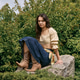 Young woman enjoys a serene moment in a beautiful park, embracing nature and style Young woman enjoys a serene moment in a beautiful park, embracing nature and style - PhotoDune Item for Sale