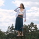 Young woman enjoys a sunny day in the park while modeling fashionable cozy attire Young woman enjoys a sunny day in the park while modeling fashionable cozy attire - PhotoDune Item for Sale