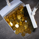 The piles of gold bars and coins were swept into the trash. The piles of gold bars and coins were swept into the trash. - PhotoDune Item for Sale