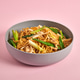 Tasty asian noodles with vegetables on pink background Tasty asian noodles with vegetables on pink background - PhotoDune Item for Sale
