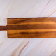 Wooden cutting board on a gray marble background Wooden cutting board on a gray marble background - PhotoDune Item for Sale