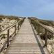 Wooden Boardwalk Walkway Climbing Up Sandy Beach Dunes in Praia de Mira Portugal Wooden Boardwalk Walkway Climbing Up Sandy Beach Dunes in Praia de Mira Portugal - PhotoDune Item for Sale