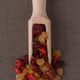 Wooden scoop with mixed dried fruits Wooden scoop with mixed dried fruits - PhotoDune Item for Sale