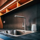 Water faucet and metallic sink in modern sleek kitchen with led strip light Water faucet and metallic sink in modern sleek kitchen with led strip light - PhotoDune Item for Sale