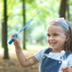 Little happy child girl blowing soap bubbles Little happy child girl blowing soap bubbles - PhotoDune Item for Sale