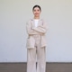 Young Thai Isan Woman Looking at Camera with Crossed Arms and White Wall Copy Space Young Thai Isan Woman Looking at Camera with Crossed Arms and White Wall Copy Space - PhotoDune Item for Sale