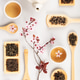 Tea Flat Lay with Teapot, Cups and Loose Tea on White Background Tea Flat Lay with Teapot, Cups and Loose Tea on White Background - PhotoDune Item for Sale
