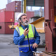 Freight supervisor inspecting cargo equipment with radio communication at shipping terminal Freight supervisor inspecting cargo equipment with radio communication at shipping terminal - PhotoDune Item for Sale