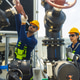 Industrial Technicians Adjusting Large Pipeline Valve Industrial Technicians Adjusting Large Pipeline Valve - PhotoDune Item for Sale