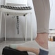 Woman's Foot Presses Pedal of Sewing Machine Under the Table. Person is Seamstress. Woman's Foot Presses Pedal of Sewing Machine Under the Table. Person is Seamstress. - PhotoDune Item for Sale