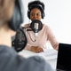 Podcasters, African American and European woman with headphones and microphone Podcasters, African American and European woman with headphones and microphone - PhotoDune Item for Sale