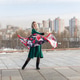 A young woman in a military dress and cap holds a beautiful fluttering scarf in a city square on May A young woman in a military dress and cap holds a beautiful fluttering scarf in a city square on May - PhotoDune Item for Sale