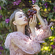 Portrait of a young woman with long hair in a pink dress among blooming lilacs. Spring blossom Portrait of a young woman with long hair in a pink dress among blooming lilacs. Spring blossom - PhotoDune Item for Sale