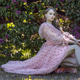 Portrait of a young woman with long hair in a pink dress among blooming lilacs. Spring blossom Portrait of a young woman with long hair in a pink dress among blooming lilacs. Spring blossom - PhotoDune Item for Sale