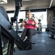 Young Woman is Working Out in the Gym, Focused on Her Exercise Routine. Young Woman is Working Out in the Gym, Focused on Her Exercise Routine. - PhotoDune Item for Sale