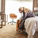 A female businesswoman arrives in her hotel room after a long conference. A female businesswoman arrives in her hotel room after a long conference. - PhotoDune Item for Sale