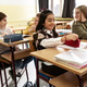 The teacher asks a question, and several students eagerly raise their hands to answer. The teacher asks a question, and several students eagerly raise their hands to answer. - PhotoDune Item for Sale