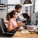 Two colleagues in a print shop work together on preparing a branding project for production. Two colleagues in a print shop work together on preparing a branding project for production. - PhotoDune Item for Sale