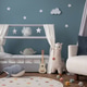 Warm and cozy child room interior with cozy bed, plush lama, white armchair, round rug, blue wall, g Warm and cozy child room interior with cozy bed, plush lama, white armchair, round rug, blue wall, g - PhotoDune Item for Sale