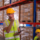 Warehouse workers wearing safety discussing inspection inventory detail storage facility shelves pac Warehouse workers wearing safety discussing inspection inventory detail storage facility shelves pac - PhotoDune Item for Sale