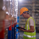 Warehouse workers wearing safety discussing inspection inventory detail storage facility shelves pac Warehouse workers wearing safety discussing inspection inventory detail storage facility shelves pac - PhotoDune Item for Sale