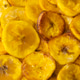 Golden Fried Plantain Slices Overhead Full Frame Food Background Golden Fried Plantain Slices Overhead Full Frame Food Background - PhotoDune Item for Sale