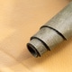 Close-Up of Rolled Distressed Olive Green Leather Piece on Cream Leather Background, Artisan Materia Close-Up of Rolled Distressed Olive Green Leather Piece on Cream Leather Background, Artisan Materia - PhotoDune Item for Sale