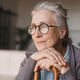 Close up of happy senior woman with wooden cane and glasses, elderly lifestyle, positive emotion Close up of happy senior woman with wooden cane and glasses, elderly lifestyle, positive emotion - PhotoDune Item for Sale