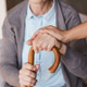 Close up of elderly woman hand with cane holds nurse hand healthcare support caregiver relationship Close up of elderly woman hand with cane holds nurse hand healthcare support caregiver relationship - PhotoDune Item for Sale