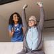 Elderly woman doing dumbbell exercises with help of young female nurse at home Elderly woman doing dumbbell exercises with help of young female nurse at home - PhotoDune Item for Sale