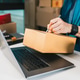 Person Labeling Shipping Box at Home Office for E-commerce Order Fulfillment Workflow Person Labeling Shipping Box at Home Office for E-commerce Order Fulfillment Workflow - PhotoDune Item for Sale